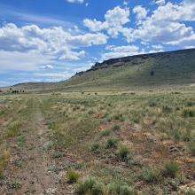 The 'road'. The second plateau on the right. The climbing route is not yet visible