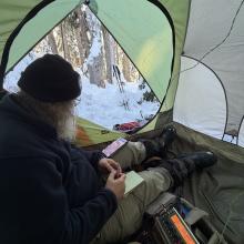 DJ working HF inside the tent