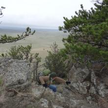 AE7AQ climbing over the rock rim