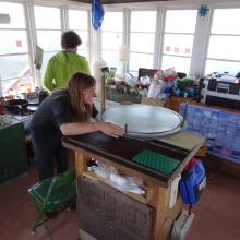 Lookout Amy demonstrates the proper use of the Osborne Fire Finder