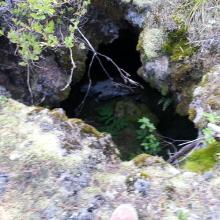 Note the toe of my boot - this is one of the small openings to lava tubes below