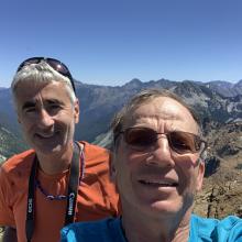 K7MAS, blue shirt & KG7EJT on Summit of Tucquala Peak.  Note mosquitos hovering and feasting!