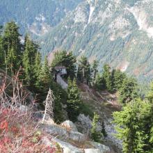 Looking down on the top of Seventh Heaven ski lift from near summit of Cowboy Mountain.  Looking down & NE from summit, there is about a 1,000 foot drop to upper basin above Hogsback Express chair. 