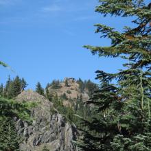 Telephoto picture of Thorp Mountain Lookout from near trail juction low point.