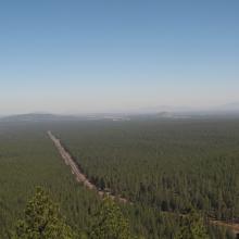 Looking towards Bend, under hazy skies, with Pilot Butte right of center 