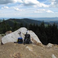Summit of Quartz Mountain.  Aptly named! Large Quartz rocks abound, including this one behind my backpack.