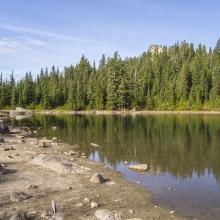 Skyline Lake, with rocky Skyline Ridge in the background.  The route traverses below the left (South) side of this false summit / sub-peak.  Photo KG7EJT.