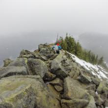 Chris descends down the ridgeline