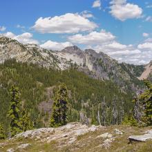 Lovely small alpine meadows just below summit block, Snoqualmie Mountain in the distance