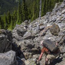 My hiking buddy and Log Book recorder, Paul Thomsen, doing some minor scrambling just above the 1/2 way point