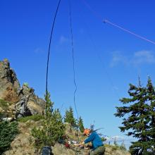 Station set up on rocky slope about 40 vert ft below true summit.