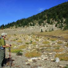 KR7W- in the meadow to the west of the top... pondering the route up the next 400 vertical feet to the summit.