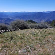 clearing at summit looking to southwest toward Siskiyou Mountains in the distance, 3 nearby SOTA peaks on right (SC-055, 024, 051 right to left)