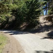 coming up Woodrat Mountain Road (from left of picture) look for start of trail (dirt road) on the left
