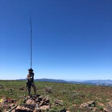 SOTA activator with rollup j-pole antenna on portable mast. 