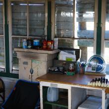 Tower inside with tables, bed, and board games