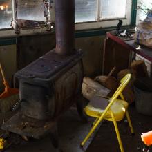 Tower inside with wood stove and chair