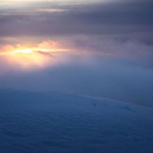 Wind and clouds along the crater rim