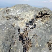 obsidian streaks on summit rocks