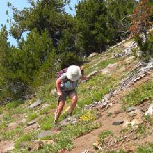 Christina struggling up the slope.